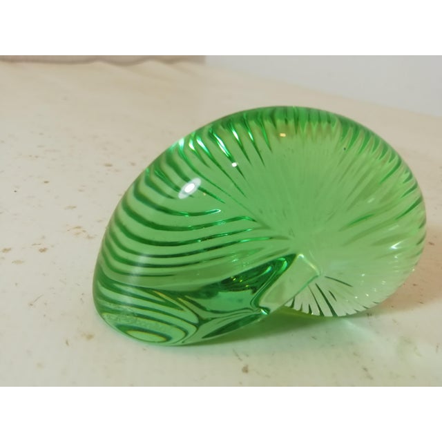 Beautiful Nautilus shell made entirely of emerald green Baccarat crystal. with original box and certificate. A beautiful...