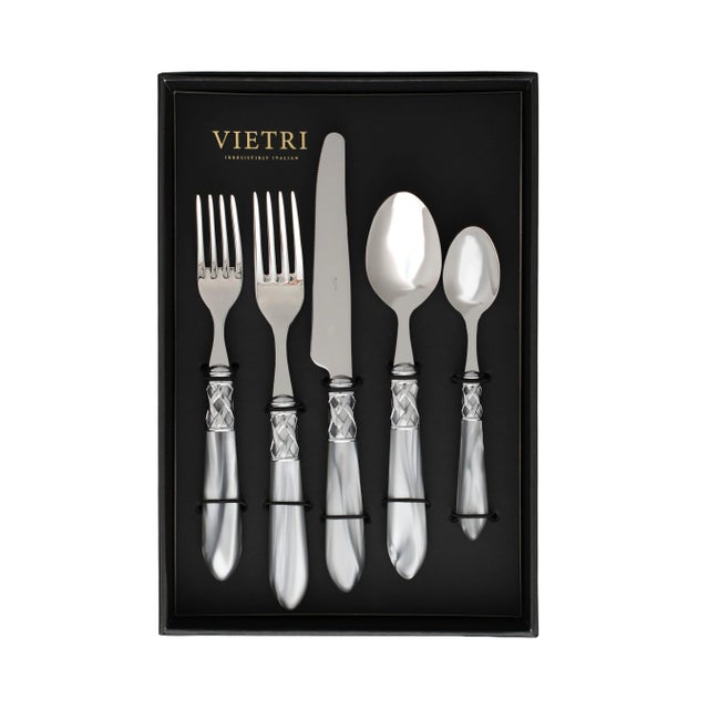 The Aladdin Brilliant Flatware Five-Piece Place Setting - service for one guest - features elegant pearlized handles with...