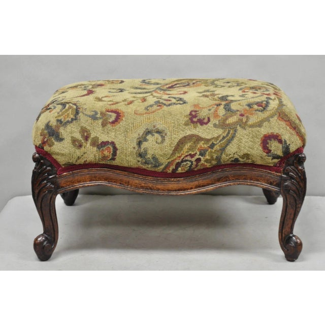 Antique French Louis XV Style Victorian Carved Mahogany Ottoman Footstool. Item features leafy carved cabriole legs and...