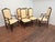 A set of six stylish French Provincial style dining chairs. The set consists of two large and roomy armchairs and four...