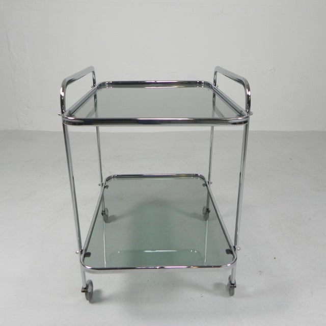 Height: 67 cm. Width: 62 cm. Depth: 45 cm. Dimensions of the gray smoked glass plates: 41 x 60 cm. Distance between the 2...