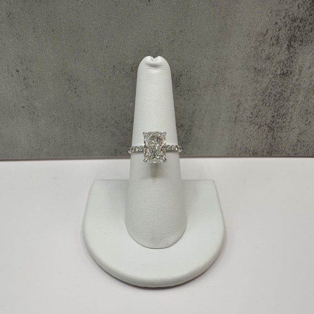 This breathtaking elongated cushion cut lab grown diamond engagement ring is crafted in 14K white gold and features a 3.02...