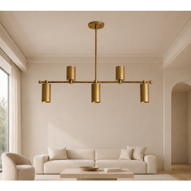 Crafted from solid brass, this handcrafted five-light linear chandelier combines clean geometry with refined...