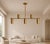 Crafted from solid brass, this handcrafted five-light linear chandelier combines clean geometry with refined...