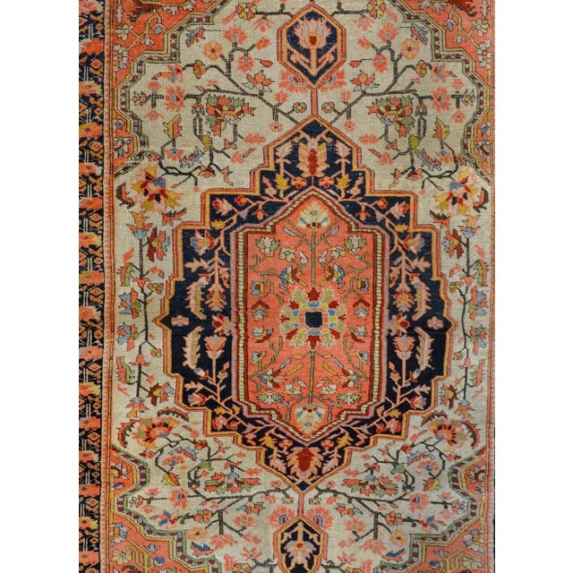 A wild early 20th century Persian Sarouk Farahan rug with fantastic pattern containing multiple medallions with myriad...
