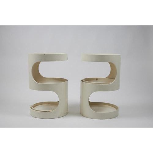 Pair of nightstands made of curved, lacquered plywood. Cylindrical frame with adjustable trays. Made in Italy. 1960s....