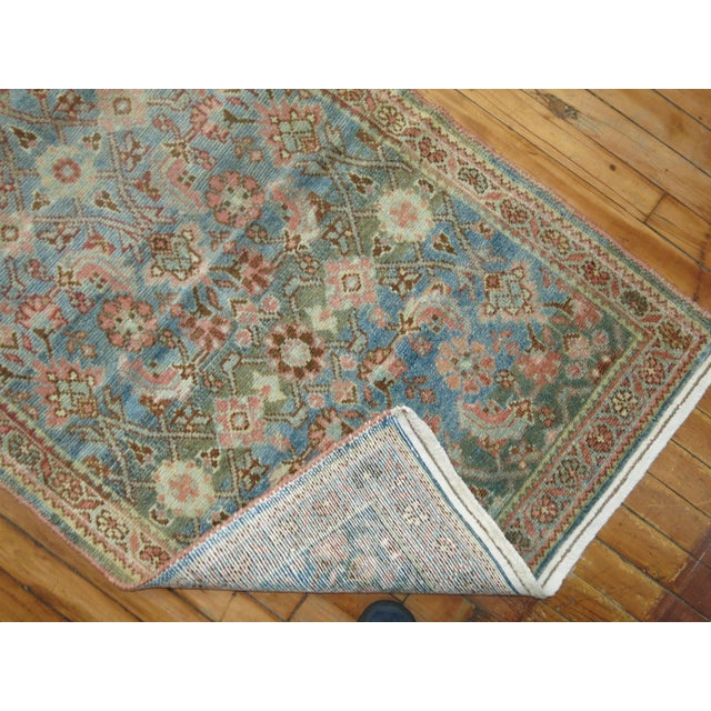 A long and narrow decorative earth toned Persian Malayer runner. 2'8'' x 20'8''