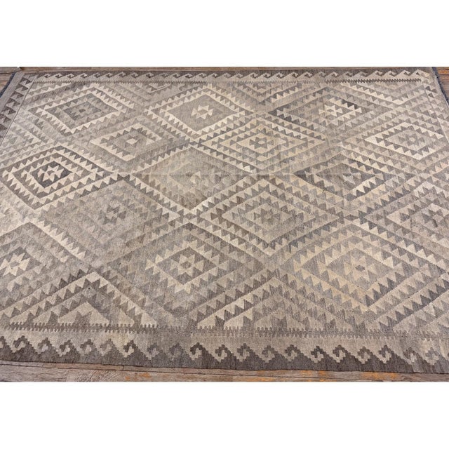 This is a striking and highly authentic antique Turkish Village Kilim, . Dating back to circa 1930, this pre-war wool...