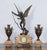 This exceptional antique French clock garniture showcases the beautifully sculpted “Amour Irresistible” angel statue,...