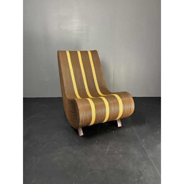 Curvy wavy pencil reed rattan bamboo low lounge chair, 1970s, Generally these chairs are attributed to Italy where...