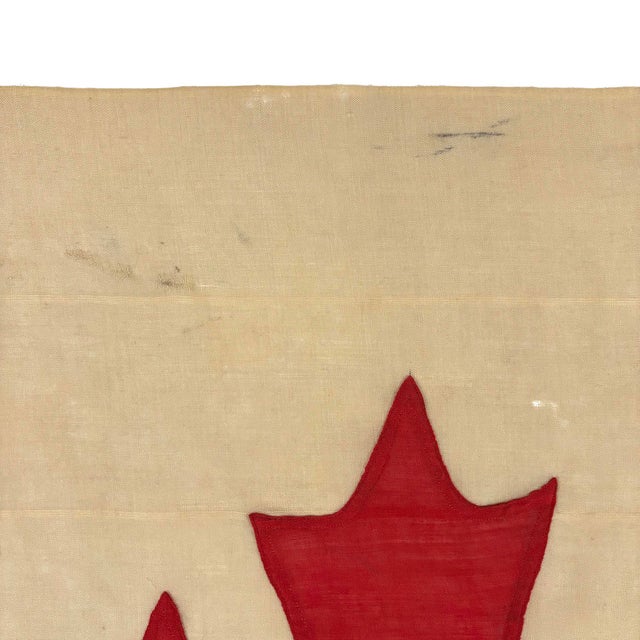 This vintage Canadian flag is made from a wool cloth with fully sewn design visible on both sides. Please note overall...