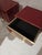 The nightstand, with its Cartier red glass surface, exudes freshness and elegance. Refined brass details extend along the...