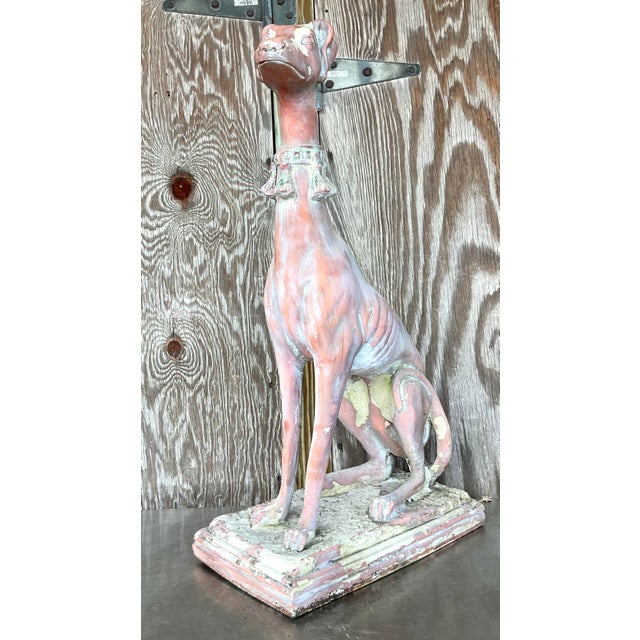 Evoke the grace and charm of the past with this Vintage Boho Patinated Resin Greyhound Statue. With its weathered finish...