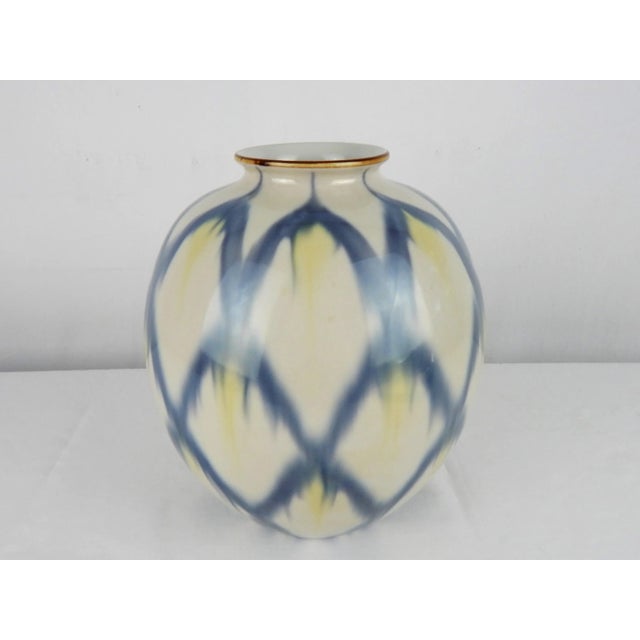 Beautifully crafted Mid-Century Japanese porcelain vase in pale hues of blue and yellow. Japanese signature on base.