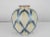 Beautifully crafted Mid-Century Japanese porcelain vase in pale hues of blue and yellow. Japanese signature on base.
