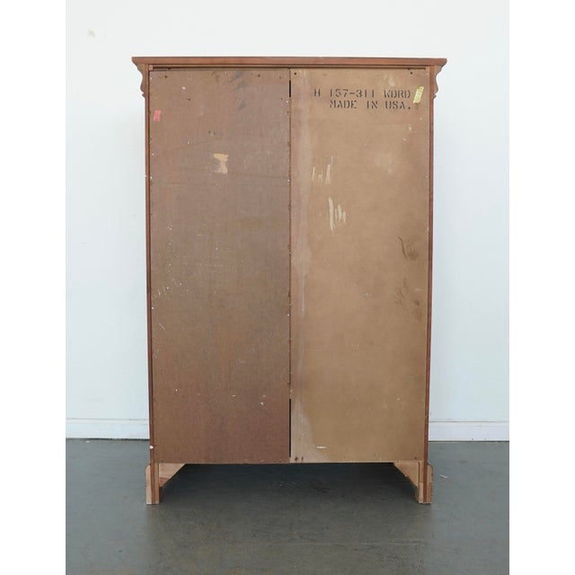 This vintage Lexington Chez Michelle wardrobe chiffonier showcases classic traditional design with refined detailing and a...
