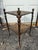 Extraordinary vintage two-tiered brass stand. Wonderful vintage patina. There is a female bust at the top of each of the...