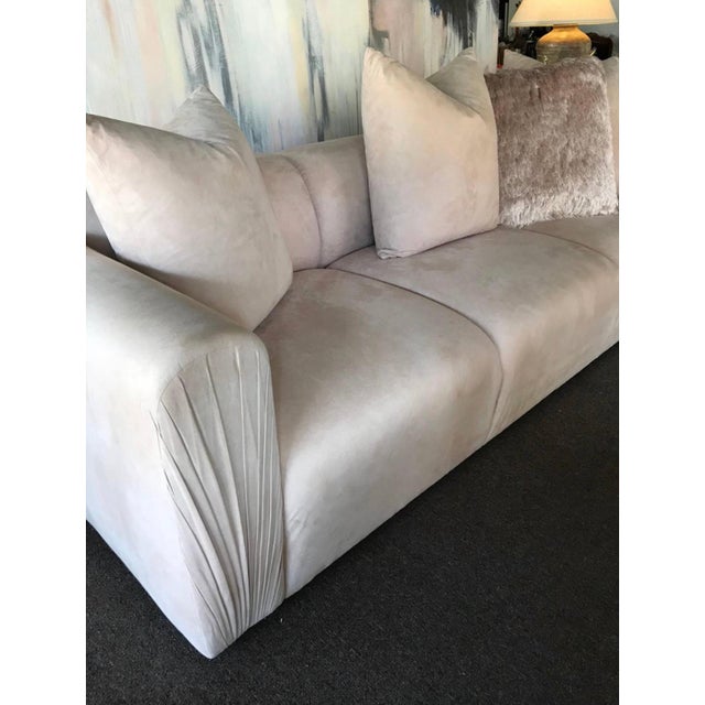 A very modern and glamorous sofa in the very current color of "blush" ultra suede that is all original. The sofa came out...