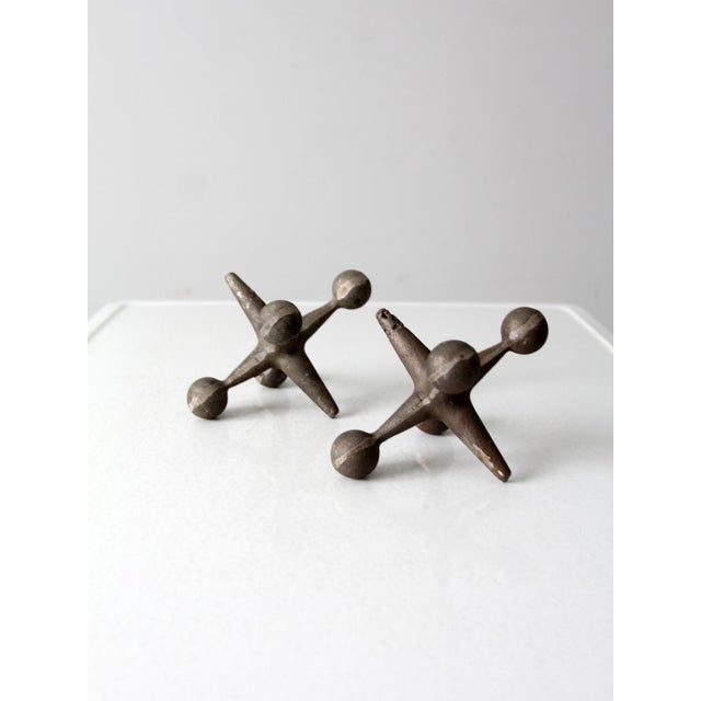 Elevate your desk or shelf with these mid 20th century cast iron jack sculptures. This unique set of decorative pieces are...