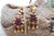 Gold earrings with reliefs and cutouts, calibrated amethyst applications in the center, turquoise and three tilting...