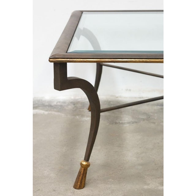 Magnificent coffee table in wrought iron and glass, handcrafted made in Italy from the 1980s/90s The structure is made of...