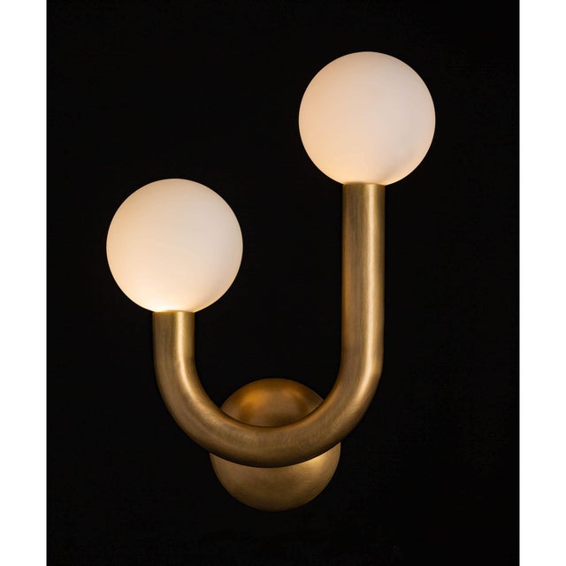 The Happy Sconce is a unique mix of modern and playful. Happy's simple, asymmetrical charm creates uplifting illumination...