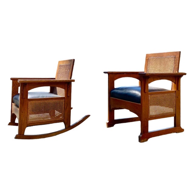 A set of two Limbert-influenced American arts and crafts chairs circa 1910 in oak with caning and leather cushions....