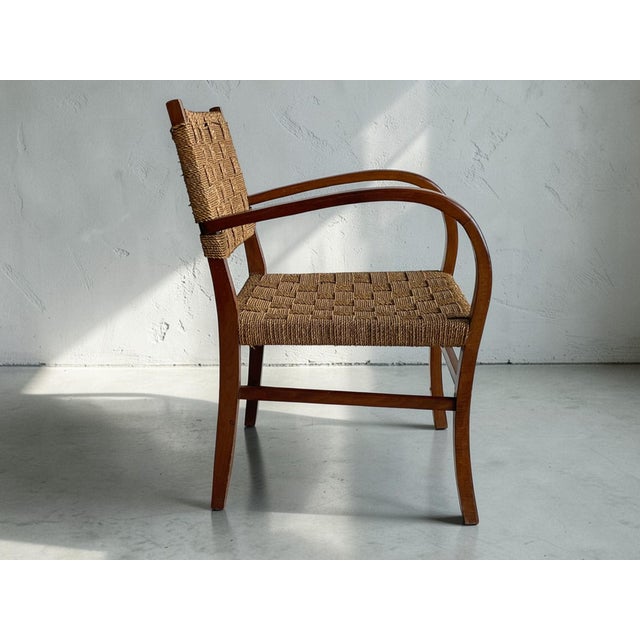 A striking modernist armchair attributed to Bauhaus designer Erich Dieckmann, produced in Germany during the 1930s. The...