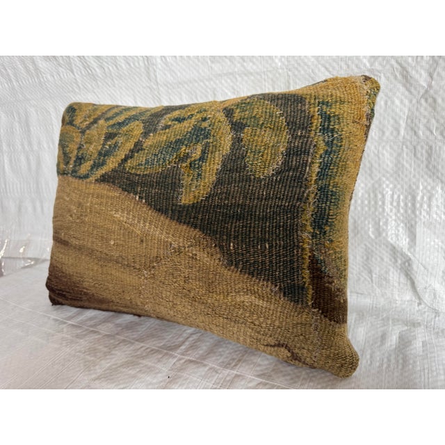 This rare 17th century Flemish tapestry pillow is created from an authentic hand woven tapestry fragment originating from...