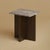 Titanium travertine over a base of solid oak gives the Tinos its balance. It is a small, low table scaled for the side of...