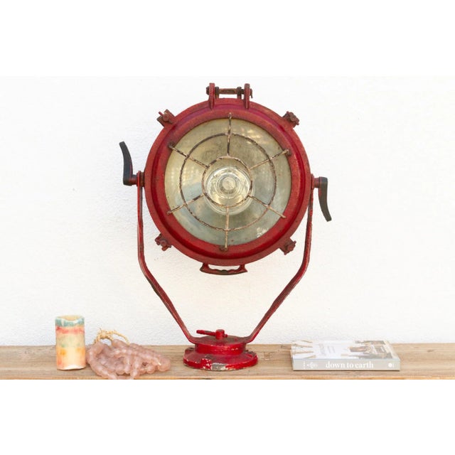 This antique nautical or industrial ship spotlight is a unique and captivating piece, crafted from metal and featuring an...