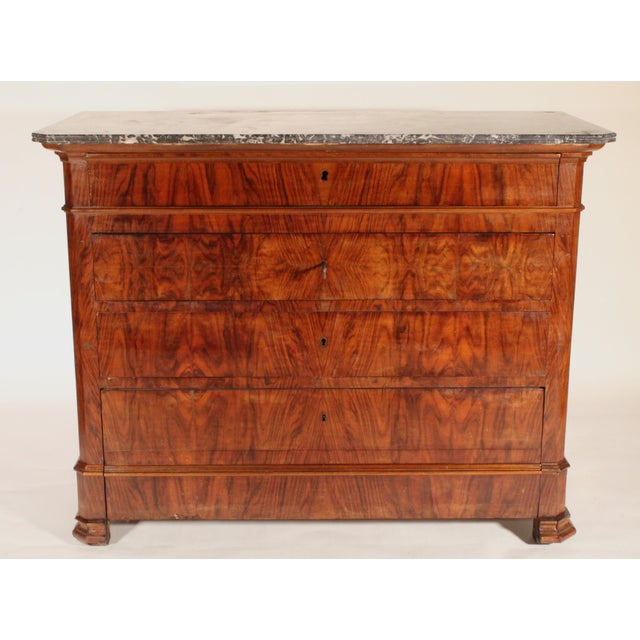 Antique Louis Philippe style burl walnut chest of drawers with marble top, 19th century. With a Saint Anne sandwich cut...