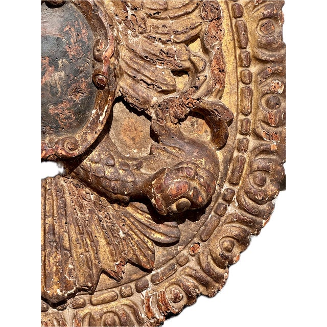 18th Century Carved and Painted Coat of Arms. Plaque features deeply hand-carved wood and retains traces of original...