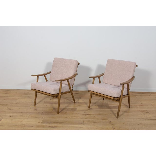 This pair armchairs was produced by the Czechoslovak company TON in the 1960s. The beech elements have been cleaned from...