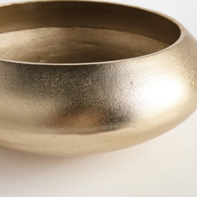 This handcrafted bowl has a simple round silhouette, with a matte finish and subtle texture. It can be styled with your...