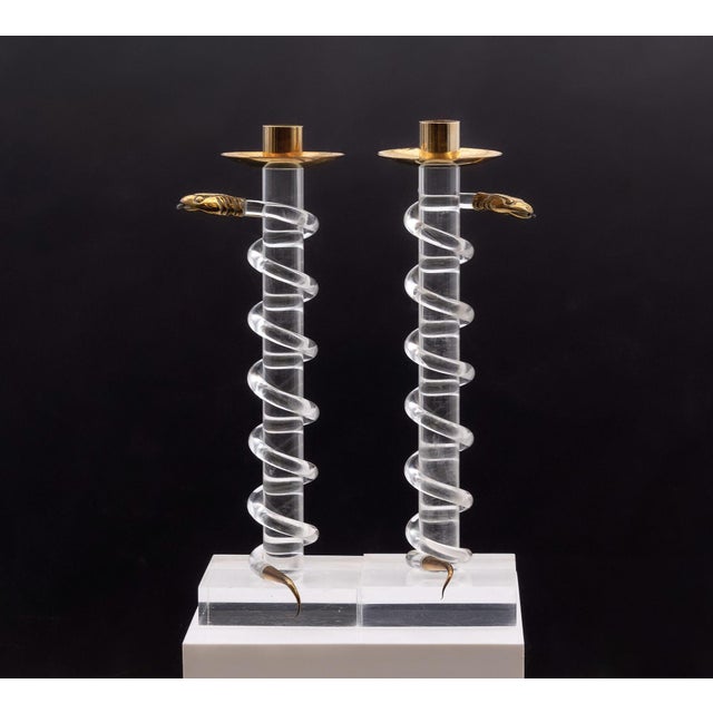Pair of acrylic and brass serpent snake candlesticks by Italian designer Alessandro Albrizzi. Circa 1970s. The...