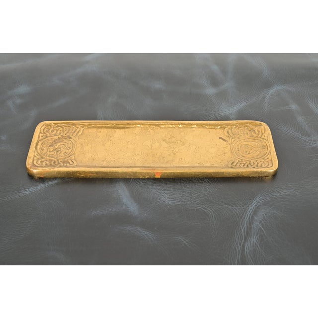 A gorgeous antique Art Deco period gilt bronze pen tray featuring Zodiac designs By Tiffany Studios (signed to the...