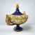 An antique porcelain lidded centerpiece / coupe. Cobalt ground with extensive gilding. Hand painted courting scenes....