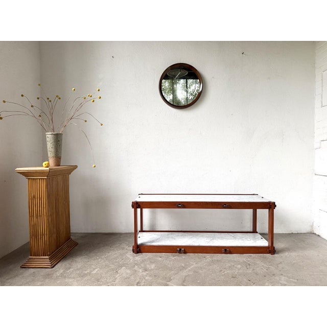 Italian modernist shelf from the 1950s, crafted from teak and Carrara marble. A low, elongated piece with a clean,...
