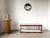Italian modernist shelf from the 1950s, crafted from teak and Carrara marble. A low, elongated piece with a clean,...