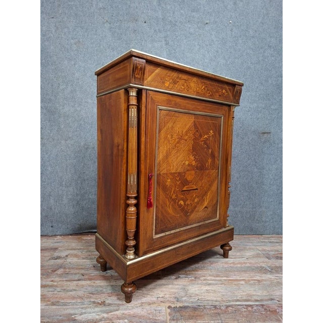 A charming small marquetry sideboard or chest of drawers from the napoleon iii period, dating from the late 19th century....
