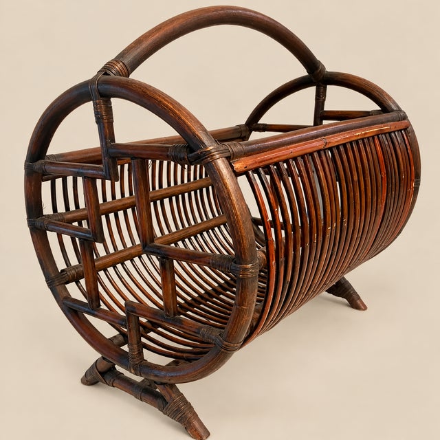 Offered is a stunning vintage bamboo Chinese Chippendale magazine rack or catch-all. This vintage piece provides the...