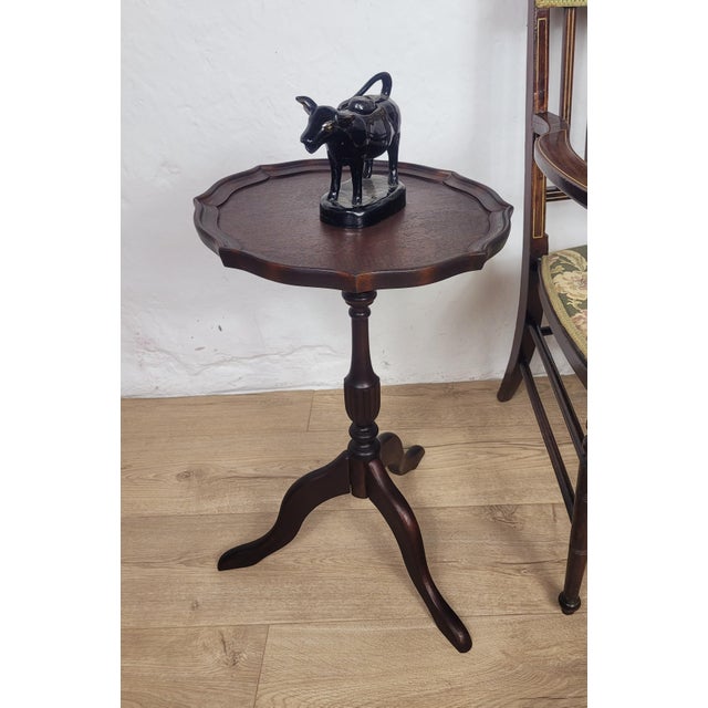 This delightful vintage tripod wine table displays a gorgeous mahogany patination, that would brighten many mid century...