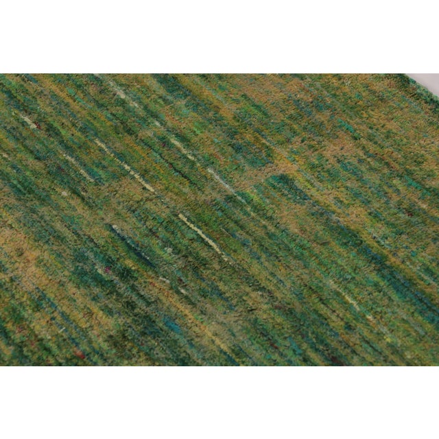Made with a luxurious hand-knotted silk, this contemporary 4x4 square rug is a rich new addition to Rug & Kilim’s Textural...