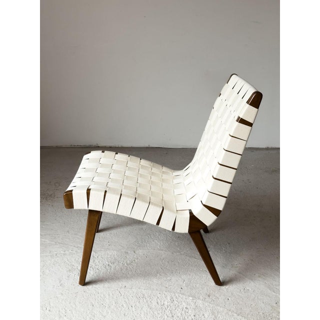 Model 654W Vostra Lounge Chair with Walnut Frame and New Webbing by Jens Risom for Knoll, 1950s, in Flawless conditions....