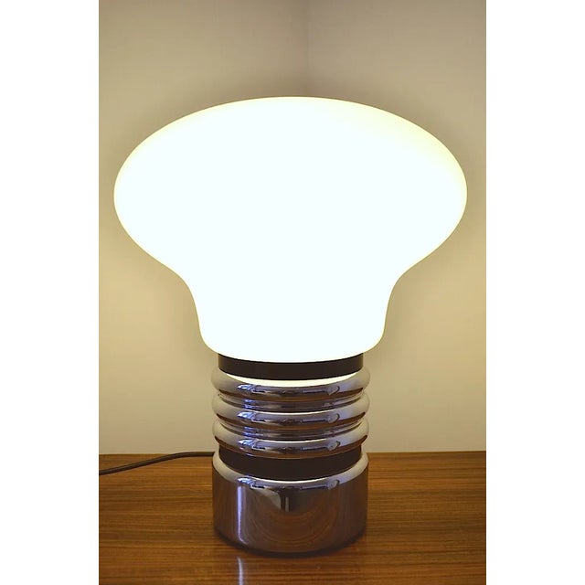 This Bulb table lamp in the form of a light bulb was produced in the 1970s - vitreous from opal glass. - The design comes...