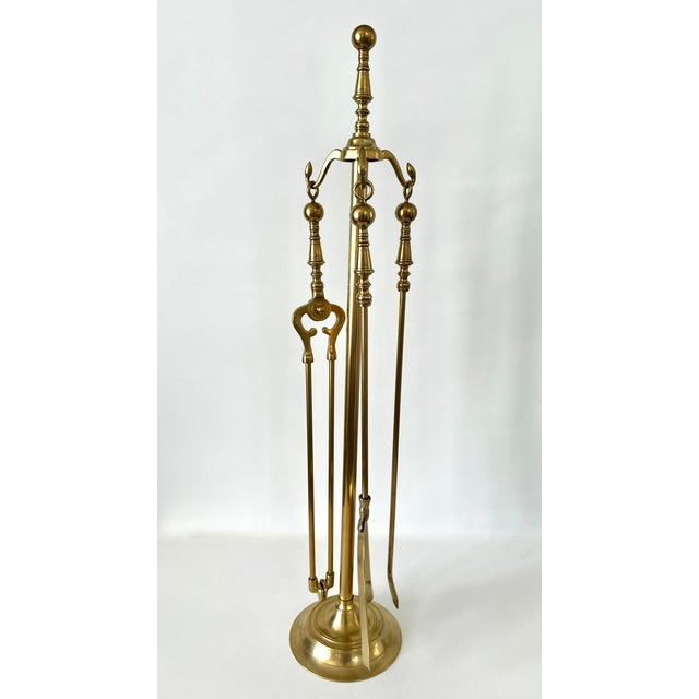 Set of reproduction Federal style unlacquered brass fireplace tools. 4 piece set includes stand, poker, tongs & shovel....
