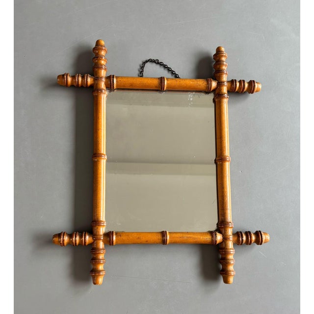 Nice old decorative wall mirror with a frame of faux-bamboo. Originating from France. In a good vintage condition, see all...