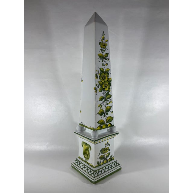 Vintage Italian porcelain square shaped obelisk with white glazed finish and floral painted decoration. Raised rams head...