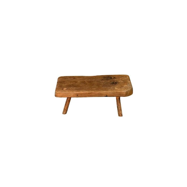 A low table made of mountain larch wood, featuring simple lines and a solid structure. The warm grain and natural look of...